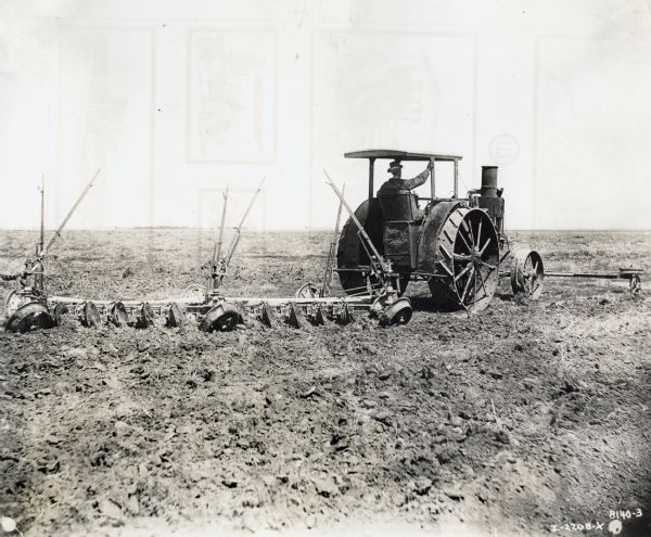 A farmer uses the "1st Avery tractor" with an attached plow in a field. The handwritten caption reads: "H.P. 20-35."