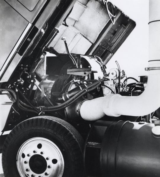 Press release photograph of an engine for an International Turbostar truck. The text of the original caption reads: "The engine for International's turbine truck prototype is built by International Harvester Company's Solar division at San Diego, Calif. Solar presently accounts for more than half of total industry sales of gas turbines in the 700-5,000 hp. range."