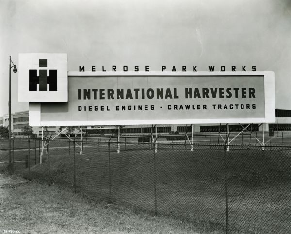 Sign for International Harvester's Melrose Park Works (factory). The sign includes the IH logo and advertises diesel engines and crawler tractors (TracTracTors).