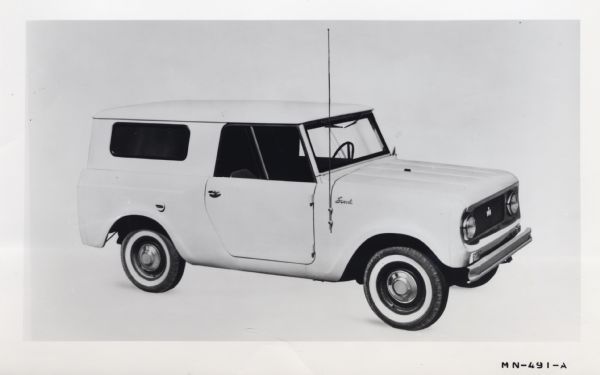 Promotional photograph of an all-purpose International Harvester Scout truck shown with a Travel Top and other optional equipment.