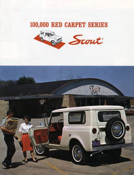 Front cover of an advertising booklet for the 100,000 Red Carpet Series Scout. The color photograph features a man and woman loading a paper bag into the vehicle in front of a grocery store.