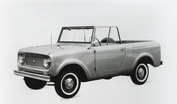 Promotional photograph of an International Harvester Scout. The vehicle is shown against a white background with its steel top removed.