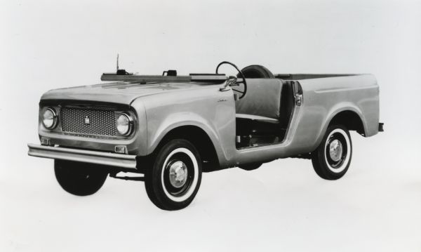 Promotional photograph of an open-top International Harvester Scout against a white background.