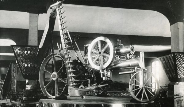 Experimental "auto mower" on display, possibly in the Deering Harvester Company display at the 1900 Paris Exposition.