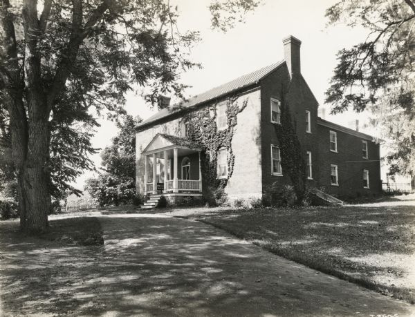 A production still of the McCormick home at Walnut Grove for the Fox Hearst film "Romance of the Reaper". The film was produced by International Harvester to celebrate the Reaper Centennial.