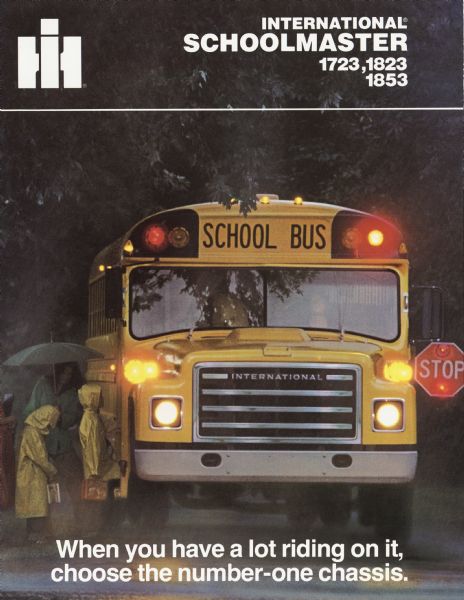 Front cover of a brochure advertising International Schoolmaster school buses. Features children boarding a bus in the rain. The children are wearing yellow slickers and carrying lunch boxes.