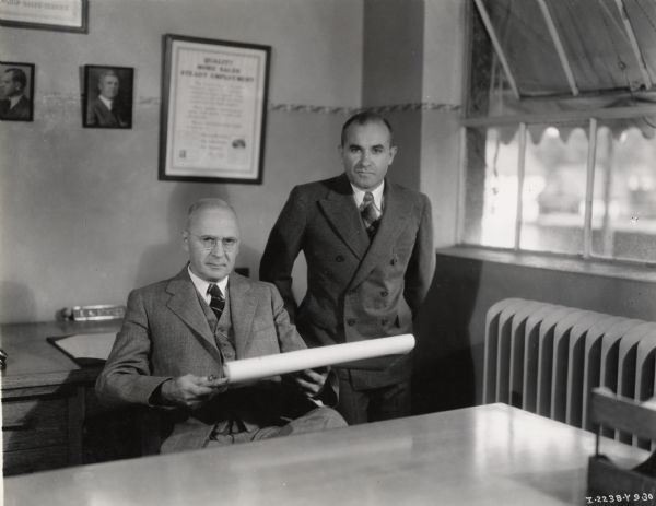 Factory Superintendent E.H. Sohner and his assistant J.W. Phillips in an office at International Harvester's Farmall Works.