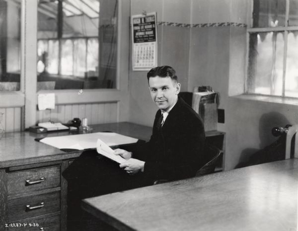 Farmall Works Production Manager C.J. King sits in his factory office.