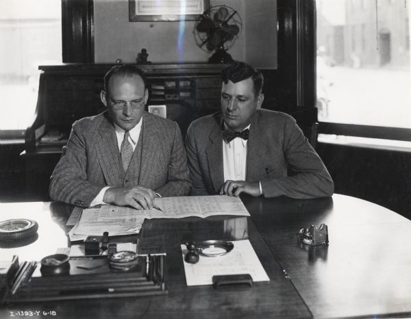 Springfield Works Superintendent K.O. Schreiber with his assistant G.H. Lindner in a factory office. Original caption reads: "Springfield Works, K.O. Schreiber supt. and G.H. Lindner ass. supt. Taken by Howard Weber."