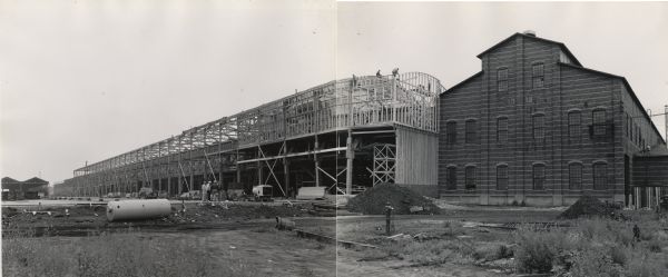 Construction site showing an additional to an International Harvester factory, probably the company's Bettendorf Tank Arsenal.