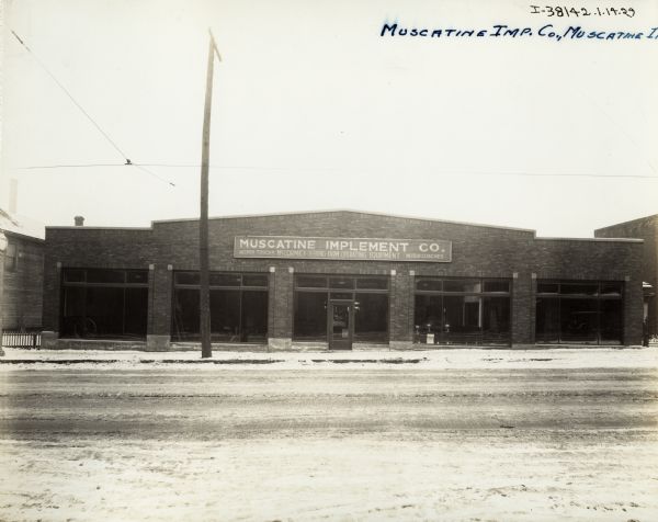 Exterior of the Muscatine Implement Company, an International Harvester dealership.