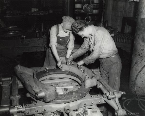 Factory workers tend to part of a high speed gun carriage at International Harvester's Milwaukee Works.
