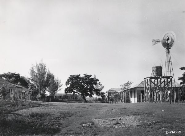 View of a worker's village on an International Harvester sisal plantation in Cuba. Caption on photograph reads, "View of typical worker's village. This village was the original location of management homes and offices."