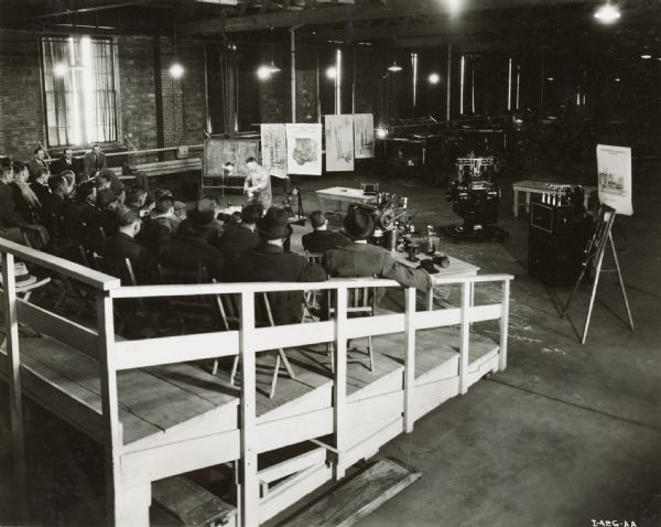 George Perikoff instructs a group of men at International Harvester's diesel school.