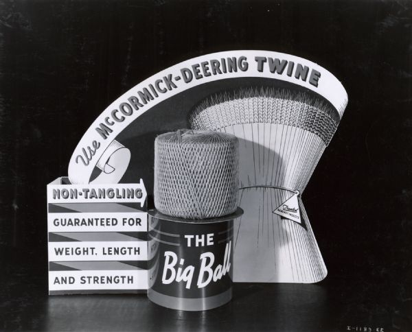 McCormick-Deering binder twine advertising display. The display includes the text,:"Use McCormick-Deering Twine," "Non-Tangling, Guaranteed for Weight, Length, and Strength," "The Big Ball," and "Treated Against Insects."