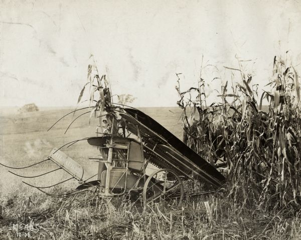 Milwaukee corn binder in a field.
