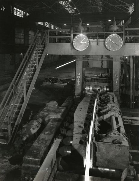 "New" blooming mill at International Harvester's Wisconsin Steel Works (factory). Original caption reads: "View of 32" blooming mill, with manipulator in foreground."