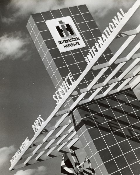 View of a red pylon and sign reading: "McCormick-Deering...Parts...Service...International." The red pylon is similar to that used at the company's "prototype" dealerships.