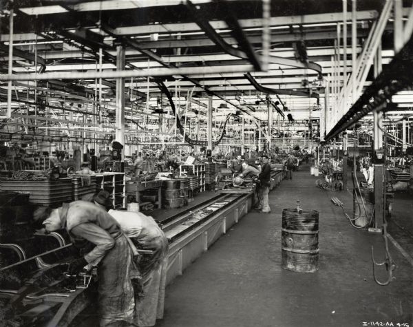 Factory workers on assembly lines at International Harvester's Springfield Works.
