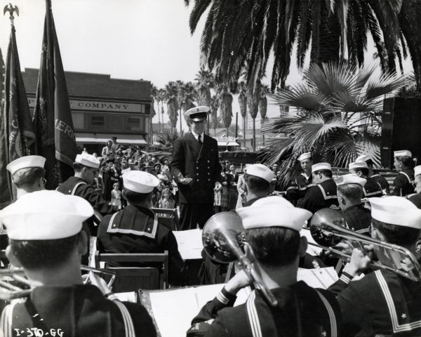 The United States Coast Guard band plays a concert for a War Bond Drive with Rudy Vallee as its conductor. The original caption reads: "U.S.C.G. (Int'l K-6) truck used during War Bond Drive by Rudy Vallee & his Coast Guard Band."