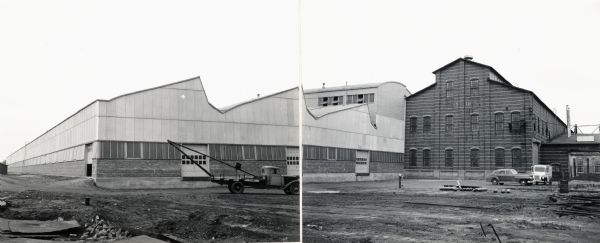 Panoramic view of what appear to be several recently completed factory buildings. The buildings may be part of International Harvester's tank arsenal at Bettendorf, Iowa. The original caption reads: "Approved on 10/27/42 for use by McQuinn in Harvester Newsletter by G.B. Nidal, Chi. Ord. Dept." The truck on the far right side of the photograph reads, "Peerless Dairy Co."