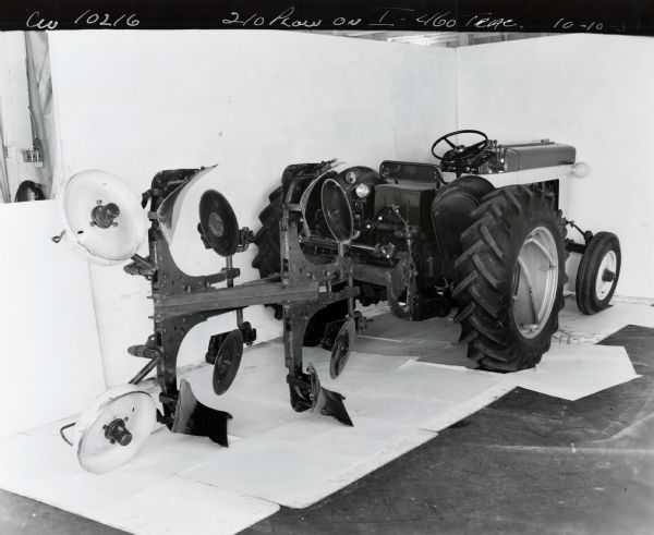 Engineering photograph of an International 460 tractor with a 210 plow.
