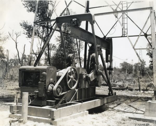 An International P-20 power unit is used to power an oil well owned by the Overton Refining Company.