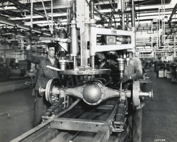 Factory workers on a truck assembly line at International Harvester's Springfield Works.
