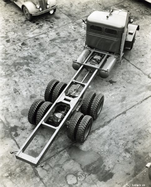Elevated view of the cab and bed of an International W-6564-OH truck with cab and exposed chassis.