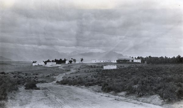 View from distance of the childhood homestead of General Jan Christian Smuts in Klipfontein, South Africa. Hills or mountains are in the background.