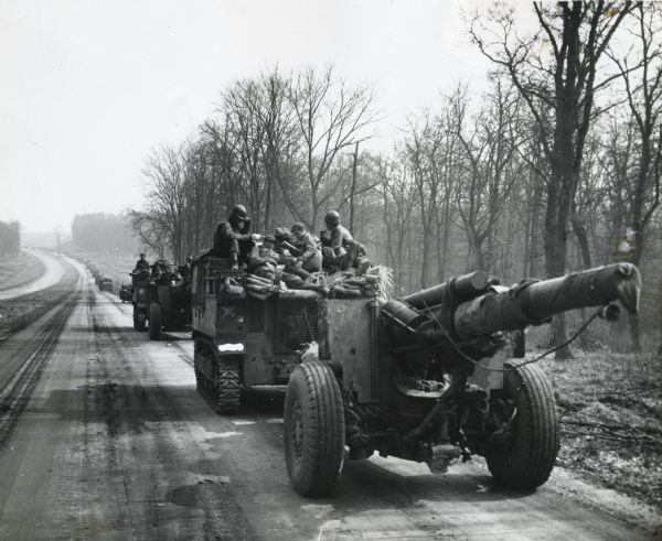 View down road towards horizon of a long line of vehicles along the autobahn. U.S. Army soldiers are driving the vehicles to deliver artillery and supplies to soldiers in Berlin, Germany.