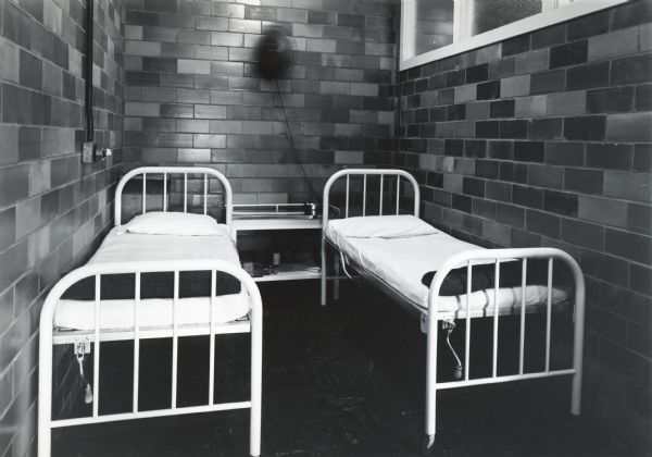 Two beds inside the emergency room of the First Aid Dispensary at International Harvester's Quad Cities Tank Arsenal.