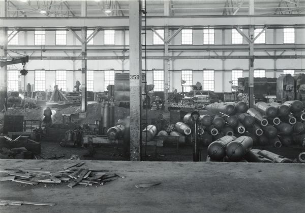Factory workers at their stations inside Bay #2 at International Harvester's Quad Cities Tank Arsenal.