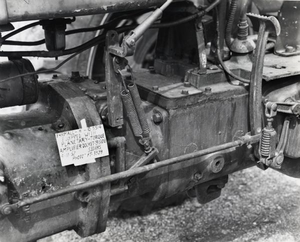 Close-up of an experimental torque amplifier mounted to a Farmall H tractor.