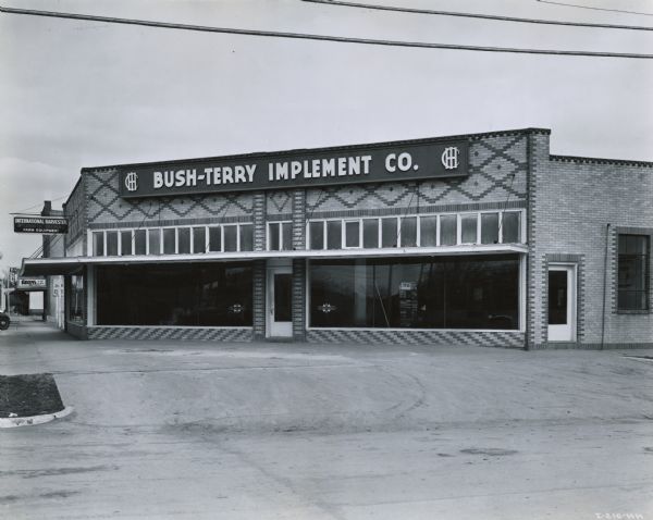 Exterior of the Bush-Terry Implement Co. storefront. The dealership was operated by R.B. Bush and J.B. Terry.