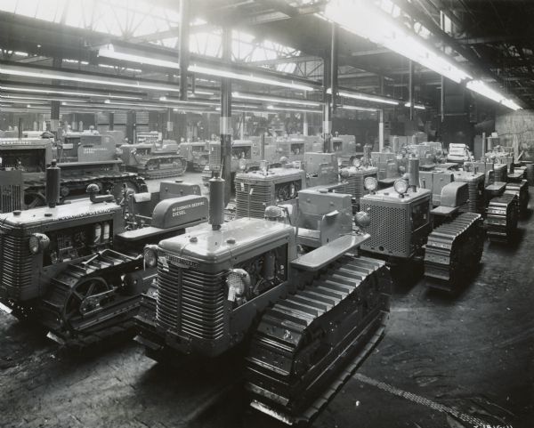 Crawler tractors (TracTracTors), including the TD-6, stored on the factory floor of International Harvester's Tractor Works.