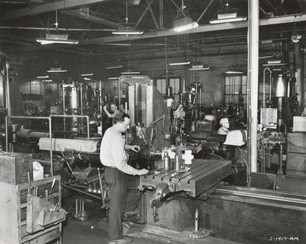 Factory workers in the machine shop experimental department at International Harvester's Tractor Works.