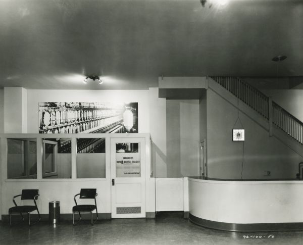 Interior view taken from outside Manager's (H.C. Groenewold) office featuring an enlarged photographic mural on the wall. The office is part of International Harvester's Dallas branch house.