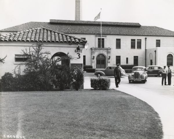 View of entrance and headquarters or administration building at a Marine Corps base, possibly Camp Elliot.