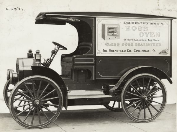 International Model M truck operated by the Huenefeld Company. The truck bears advertising for the company's "Boss Oven."