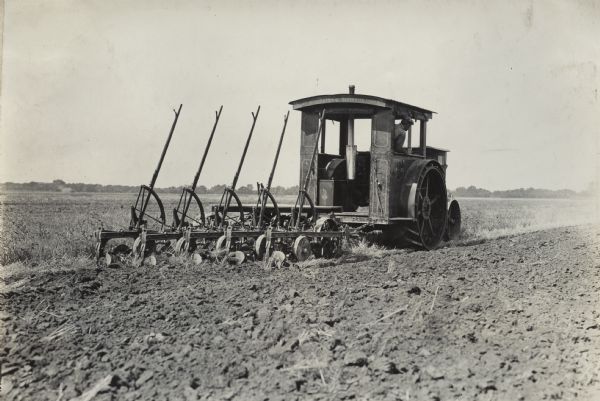 Man plowing a field with a Titan 18-35 tractor.