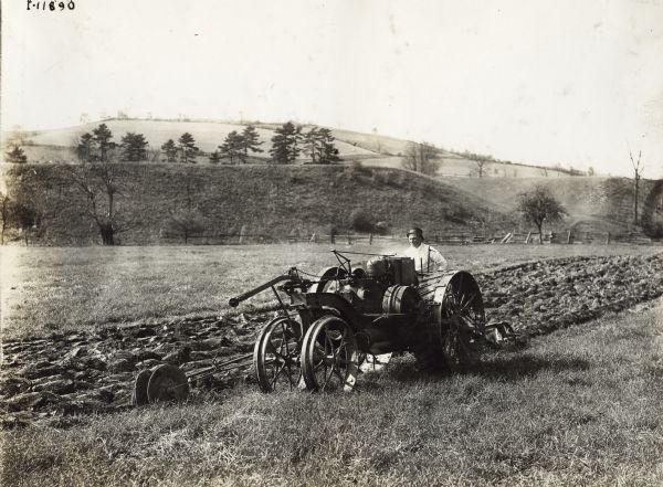 Man plowing a field with a Mogul 8-16 tractor.