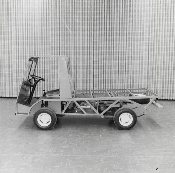 Side view of International prototype WUT (World Utility Vehicle) with exposed bed frame revealing its simple and easy-to-build design.