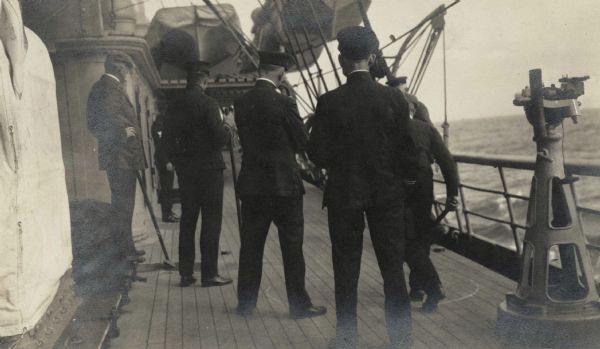 Members of the Root Commission trip to Russia playing "ship golf" on board the <i>Buffalo</i>. Original caption identifies the participants as: "Cyrus McCormick, Jr., Ensign Bagby, Dr. Camerer, Paymaster Alkire, Mr. Miles and Mr. Bertron."