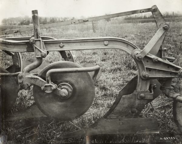Close-up of an International Harvester P&O (Parlin and Orendorff) tractor plow in a field.