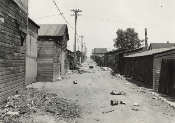 View down littered back alley in Hammond's "Little Italy."