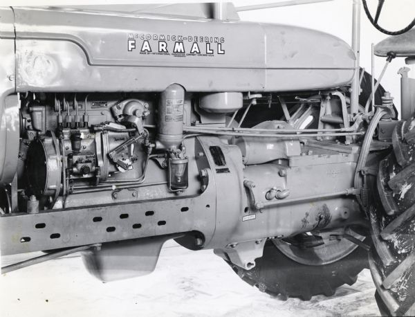 Left side view of a Farmall M (diesel) showing generator and decal placement.