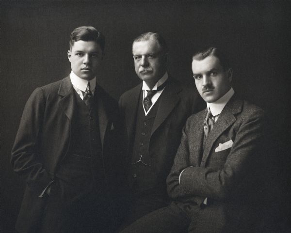 Studio portrait of Cyrus McCormick, Jr. and his sons (?) dressed in three-piece suits and neckties. The men are (left to right): Gordon McCormick(?); Cyrus McCormick, Jr. and Cyrus McCormick III ("Cyrusie").