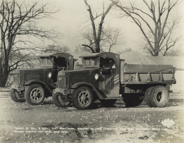 Two International HS-54 dump-trucks loaded with gravel. Original caption reads: "Model HS 54 Cylinder, 148" wheelbase, mounted on 36x8 front and 56x8 dual pneumatic tires rear. Herman Tractor Cab with Dump Body."