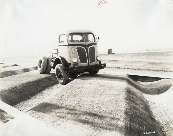 International DR-700 truck driving on "twist course" at Fort Wayne Proving Grounds.